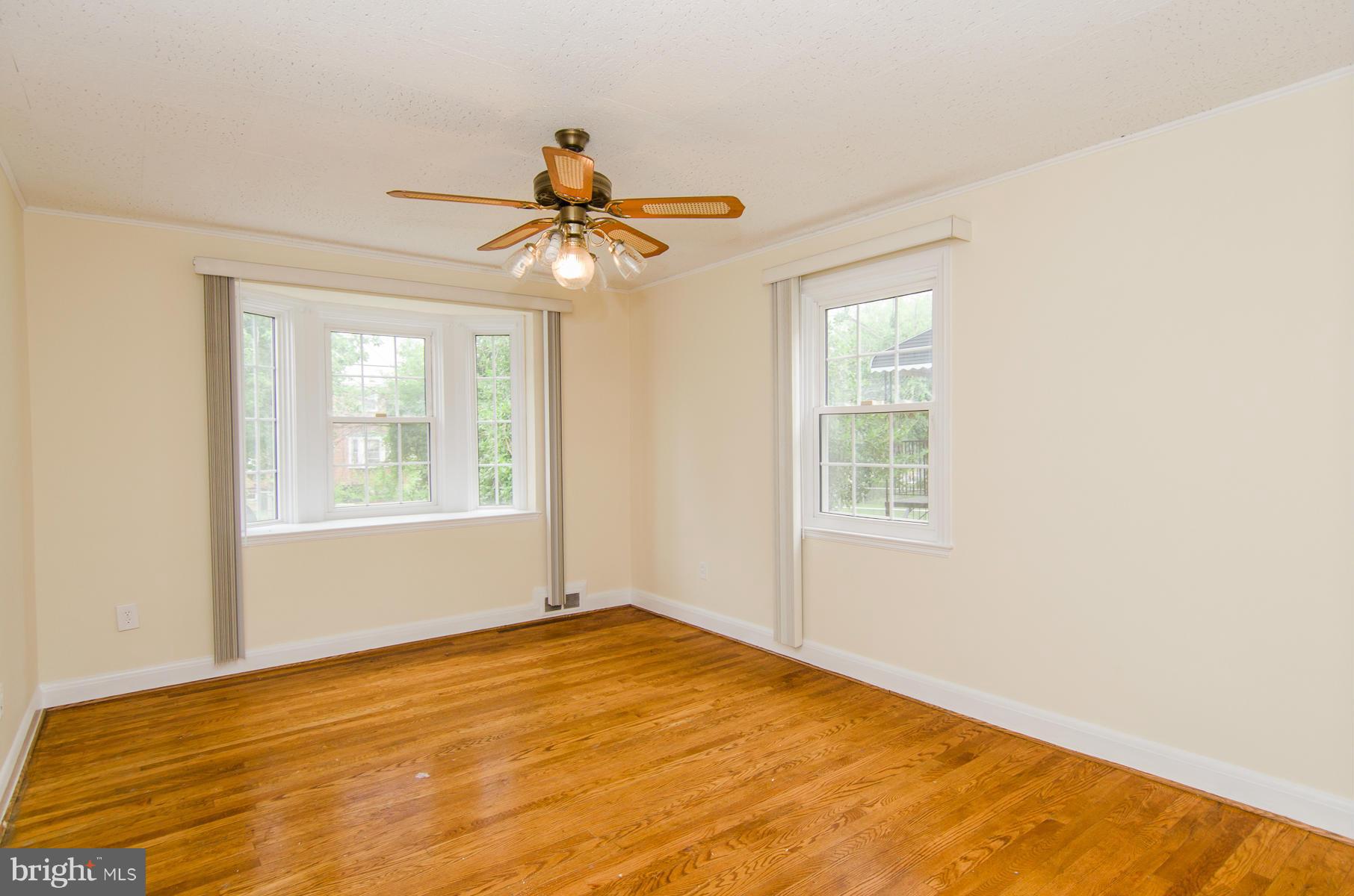 1417 Stonewood Road Baltimore, MD 21239 - Photo 5 of 28 a view of an empty room with a window