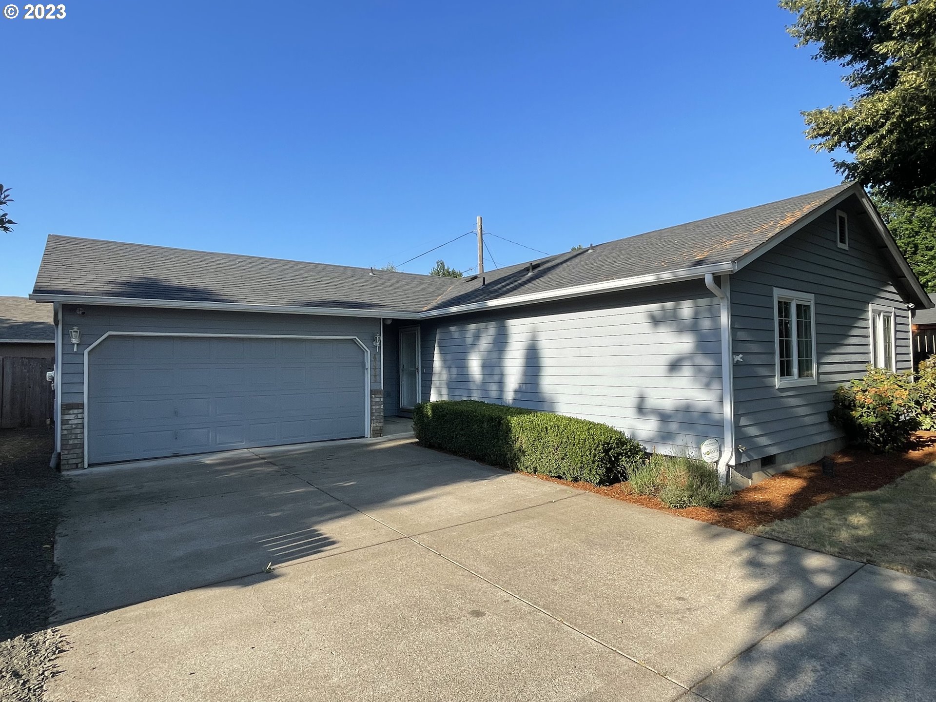 4033 Virginia Avenue Springfield, OR 97478 - Photo 1 of 29 a front view of a house with a yard and garage