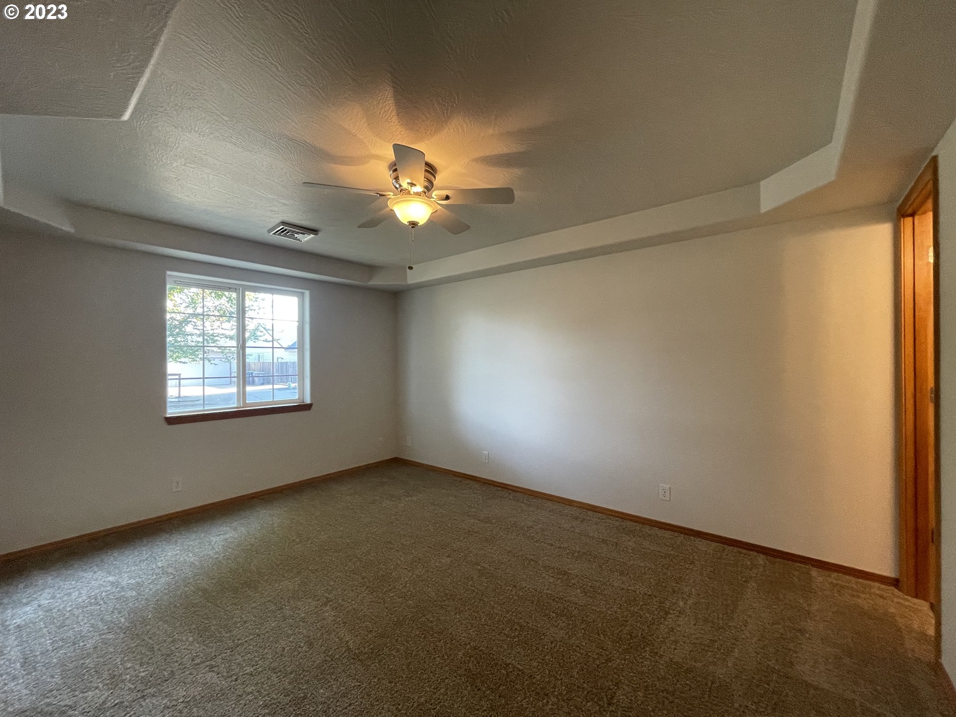 4033 Virginia Avenue Springfield, OR 97478 - Photo 13 of 29 an empty room with windows and chandelier fan