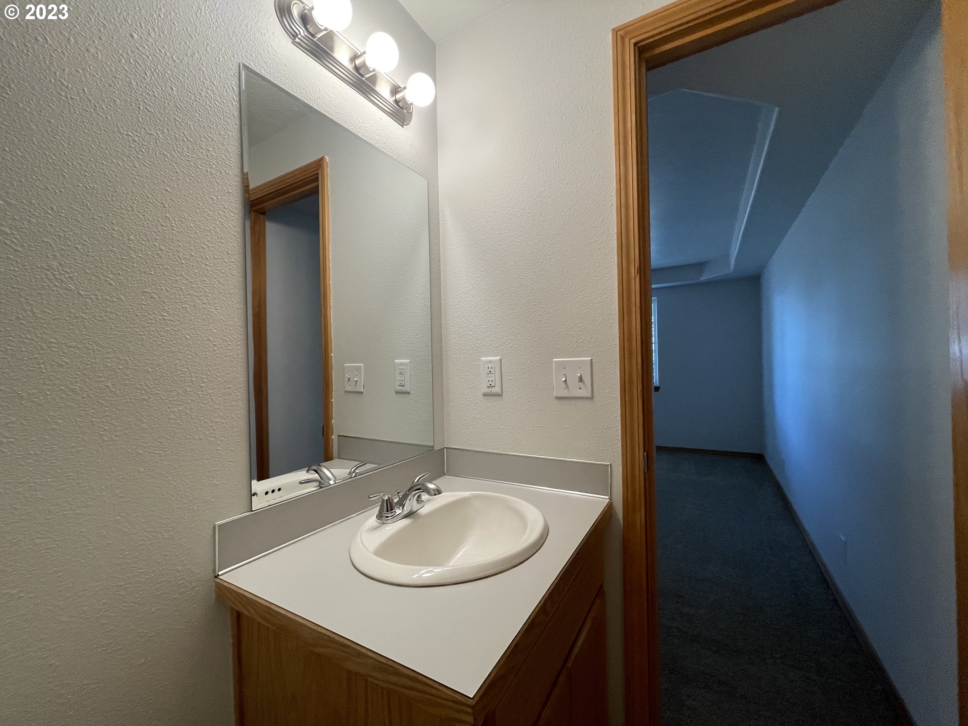 4033 Virginia Avenue Springfield, OR 97478 - Photo 15 of 29 a bathroom with a sink and a mirror