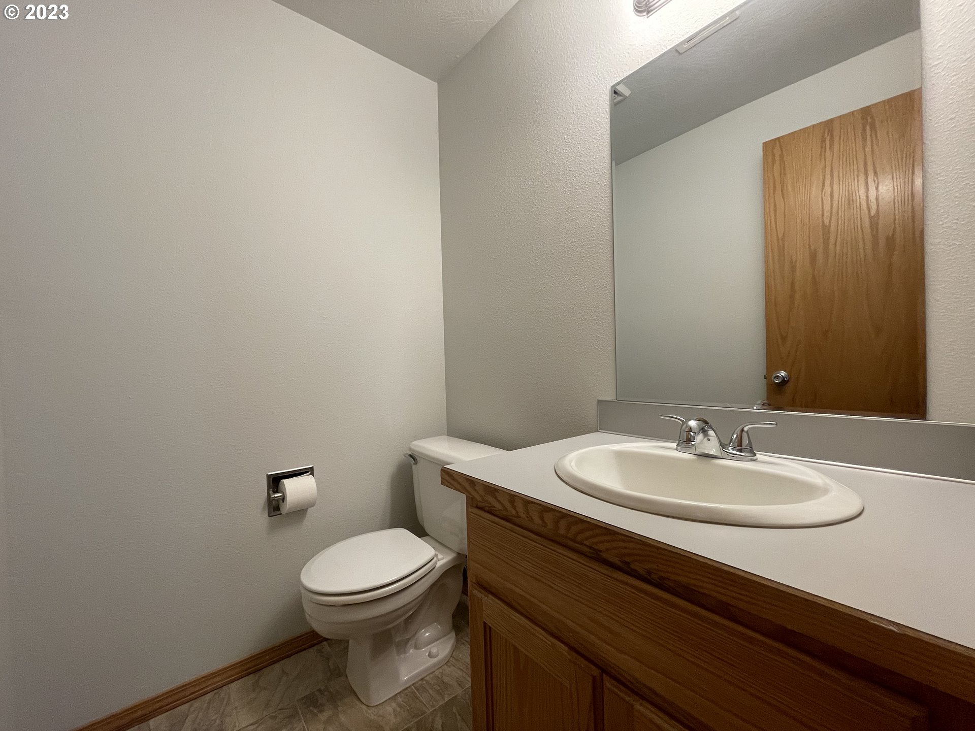 4033 Virginia Avenue Springfield, OR 97478 - Photo 16 of 29 a bathroom with a toilet a sink and mirror