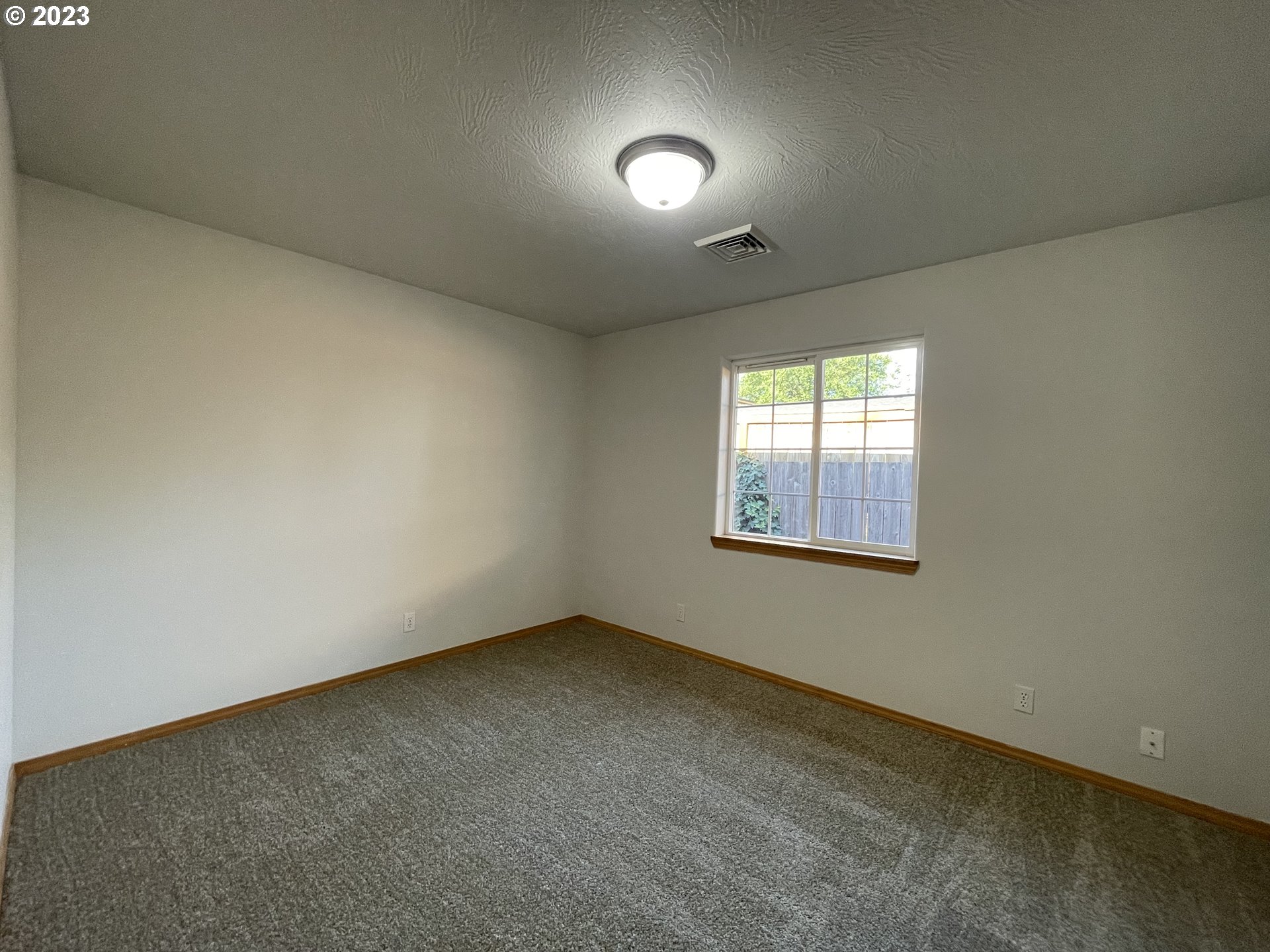 4033 Virginia Avenue Springfield, OR 97478 - Photo 17 of 29 an empty room with a empty space and windows
