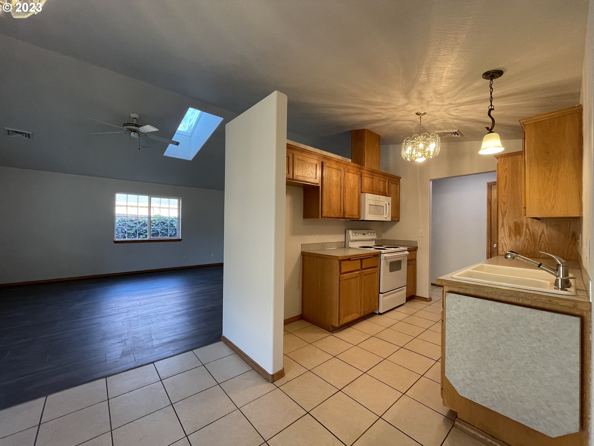 4033 Virginia Avenue Springfield, OR 97478 - Photo 2 of 29 a view of a kitchen with a sink stove cabinets and empty room