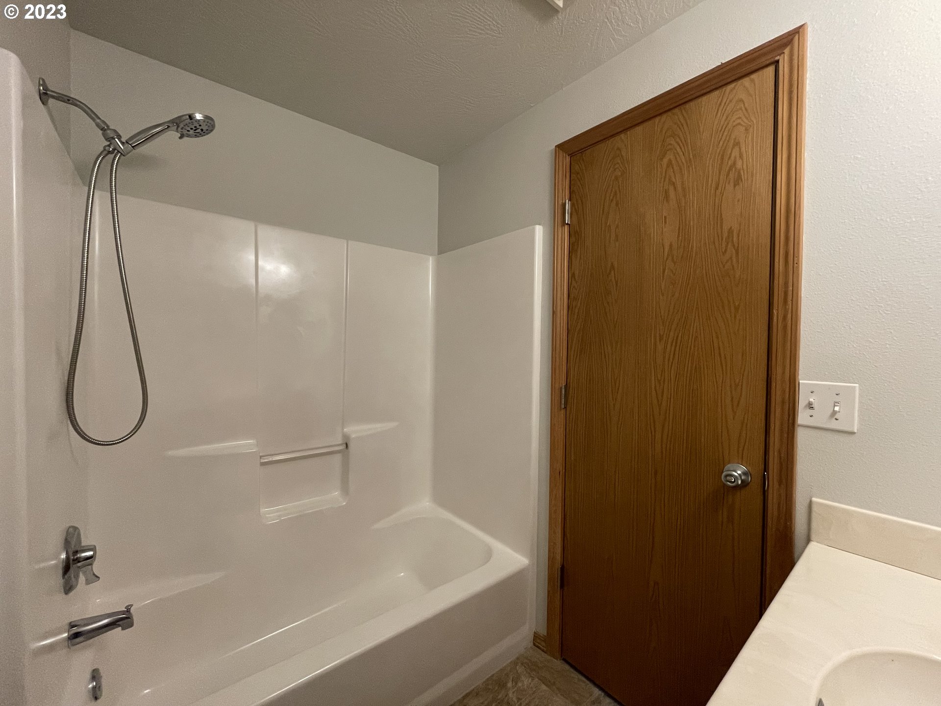 4033 Virginia Avenue Springfield, OR 97478 - Photo 24 of 29 a bathroom with a glass shower door
