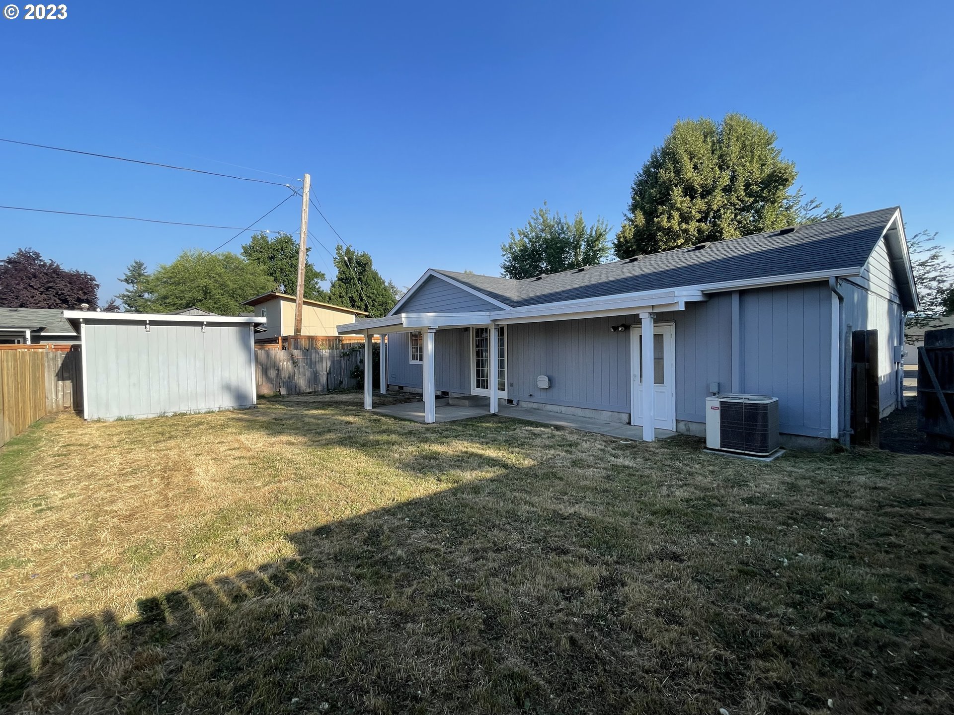 4033 Virginia Avenue Springfield, OR 97478 - Photo 26 of 29 a view of a house with a backyard and a tree