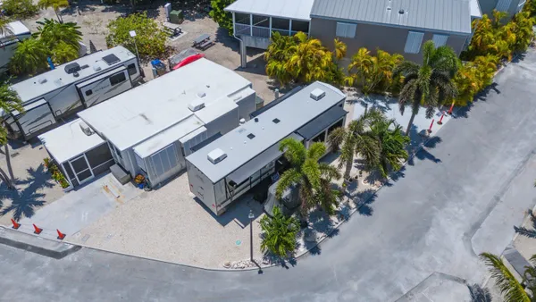 an aerial view of a house with a yard and garden view