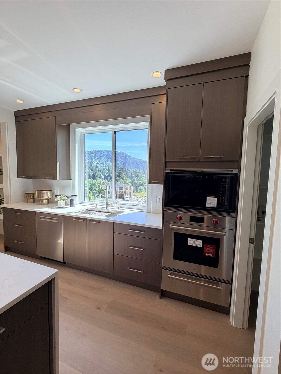 4305 Northeast 26th Court Renton, WA 98059 - Photo 11 of 40 a kitchen with stainless steel appliances a stove and a refrigerator