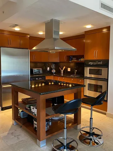a view of a dining room with furniture and window