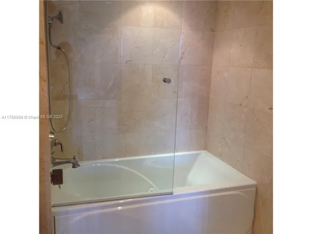 a view of a glass door and an outdoor space