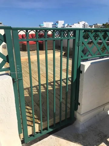 a view of a balcony with seating space