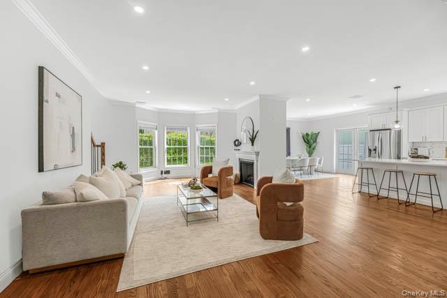 1 Kewanee Road New Rochelle, NY 10804 - Photo 15 of 36 a living room with furniture wooden floor and a large window