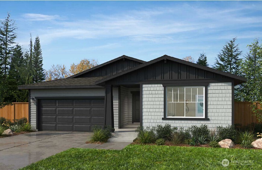 a view of a house with yard and a garden