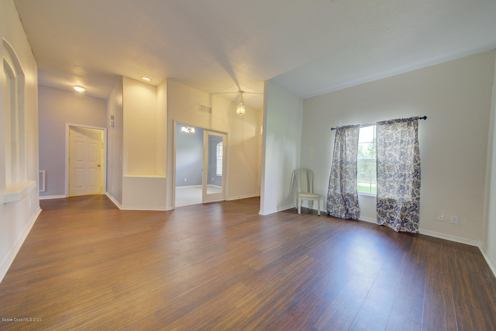 436 Larino Road Southwest Palm Bay, FL 32908 - Photo 12 of 48 Formal Living Room Wood Laminate Floor