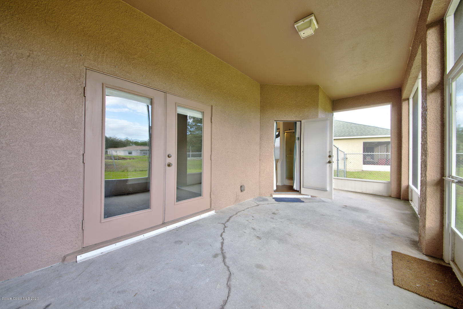 436 Larino Road Southwest Palm Bay, FL 32908 - Photo 45 of 48 Screen Enclosed Patio access to Master B