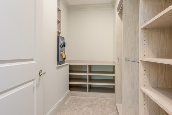 64 Simons Road, Unit F Mashpee, MA 02649 - Photo 18 of 33 a view of walk in closet with empty racks