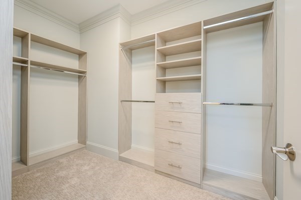 64 Simons Road, Unit F Mashpee, MA 02649 - Photo 19 of 33 a view of walk in closet with empty racks