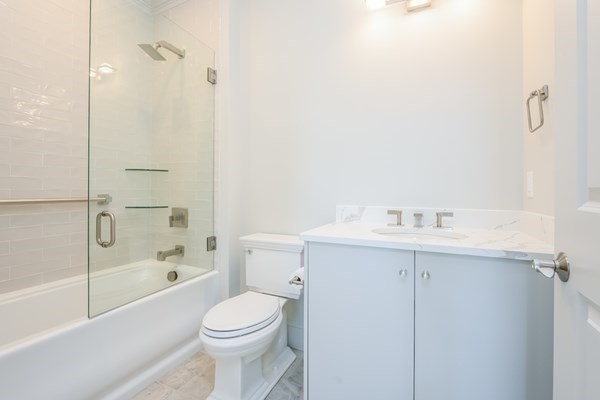 64 Simons Road, Unit F Mashpee, MA 02649 - Photo 21 of 33 a bathroom with a sink toilet and shower