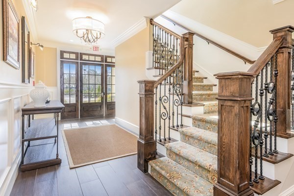 64 Simons Road, Unit F Mashpee, MA 02649 - Photo 24 of 33 a view of entryway and hall with wooden floor