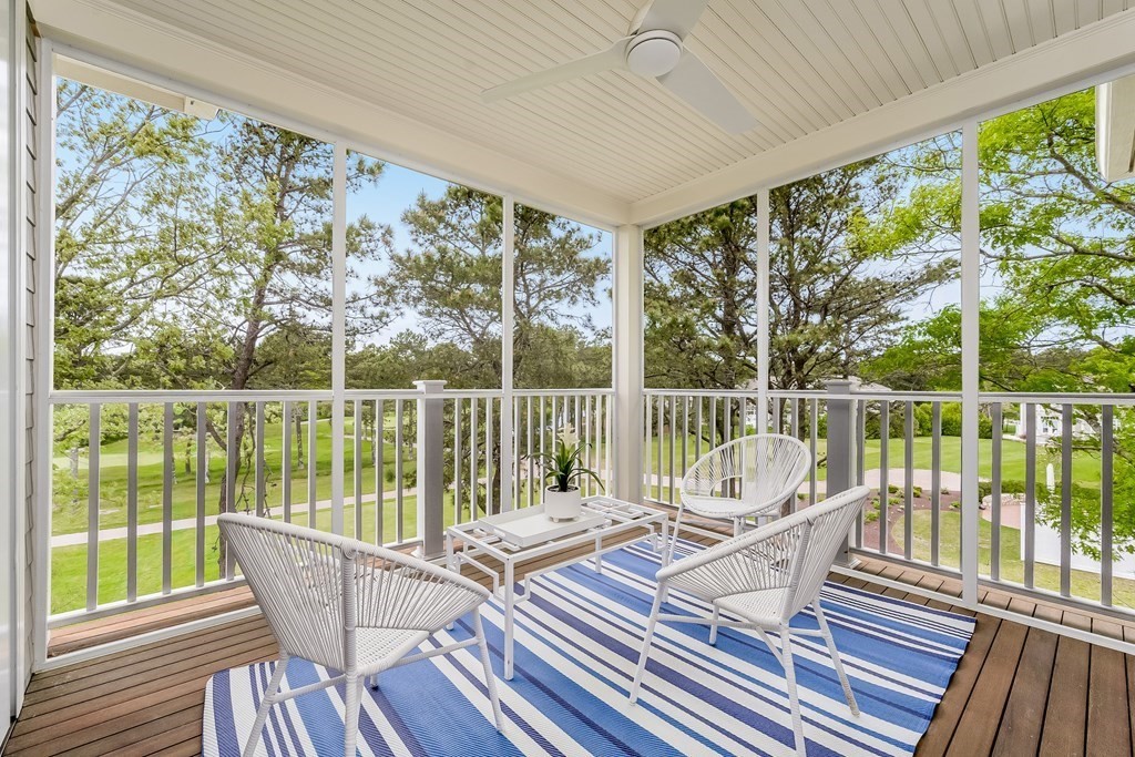 64 Simons Road, Unit F Mashpee, MA 02649 - Photo 3 of 33 a house view with a seating space and a ocean view