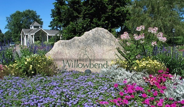 64 Simons Road, Unit F Mashpee, MA 02649 - Photo 32 of 33 a view of a sign board with flower plants