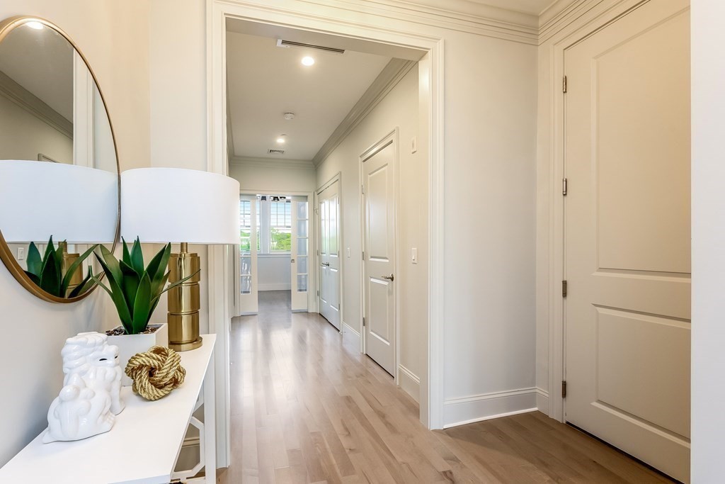 64 Simons Road, Unit F Mashpee, MA 02649 - Photo 10 of 33 a view of entryway with wooden floor