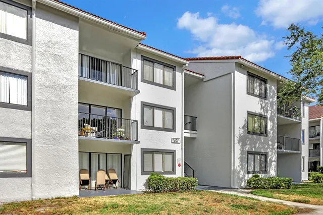 a view of a building with a yard