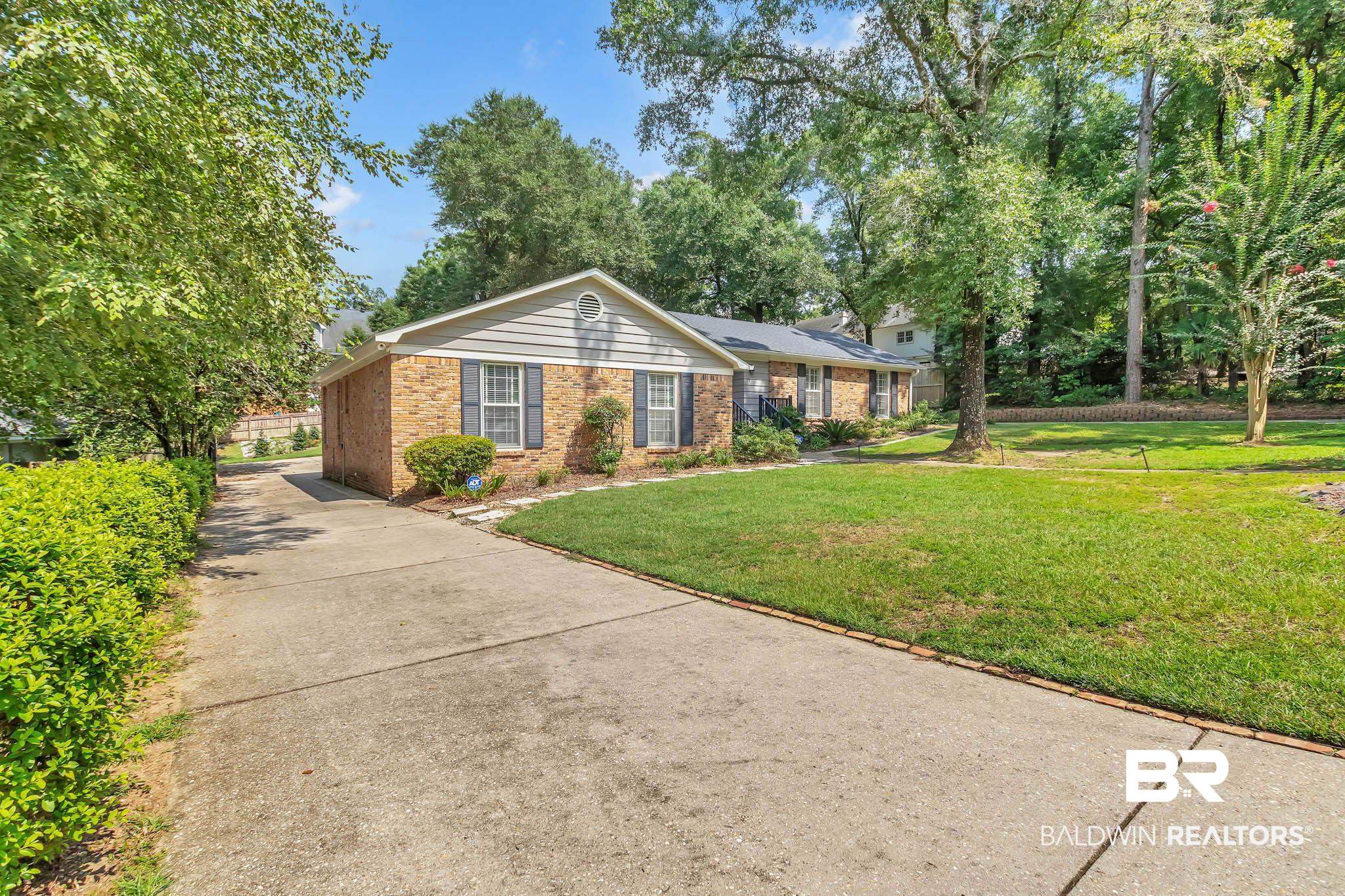 309 West Brandy Run Road Mobile, AL 36608 - Photo 5 of 100 Single story home featuring a front lawn, brick siding, and driveway