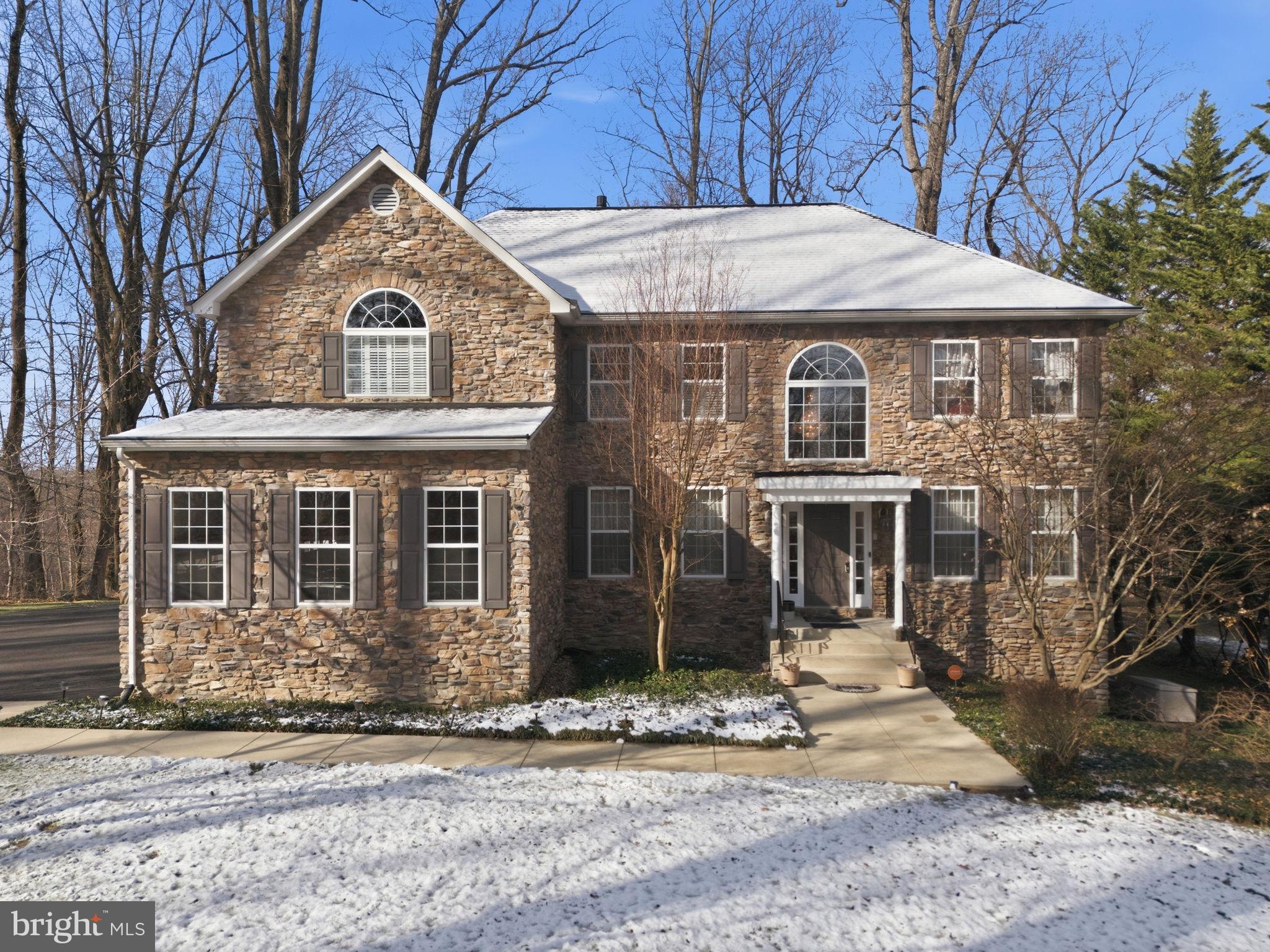 Charming stone home nestled in serene woods.