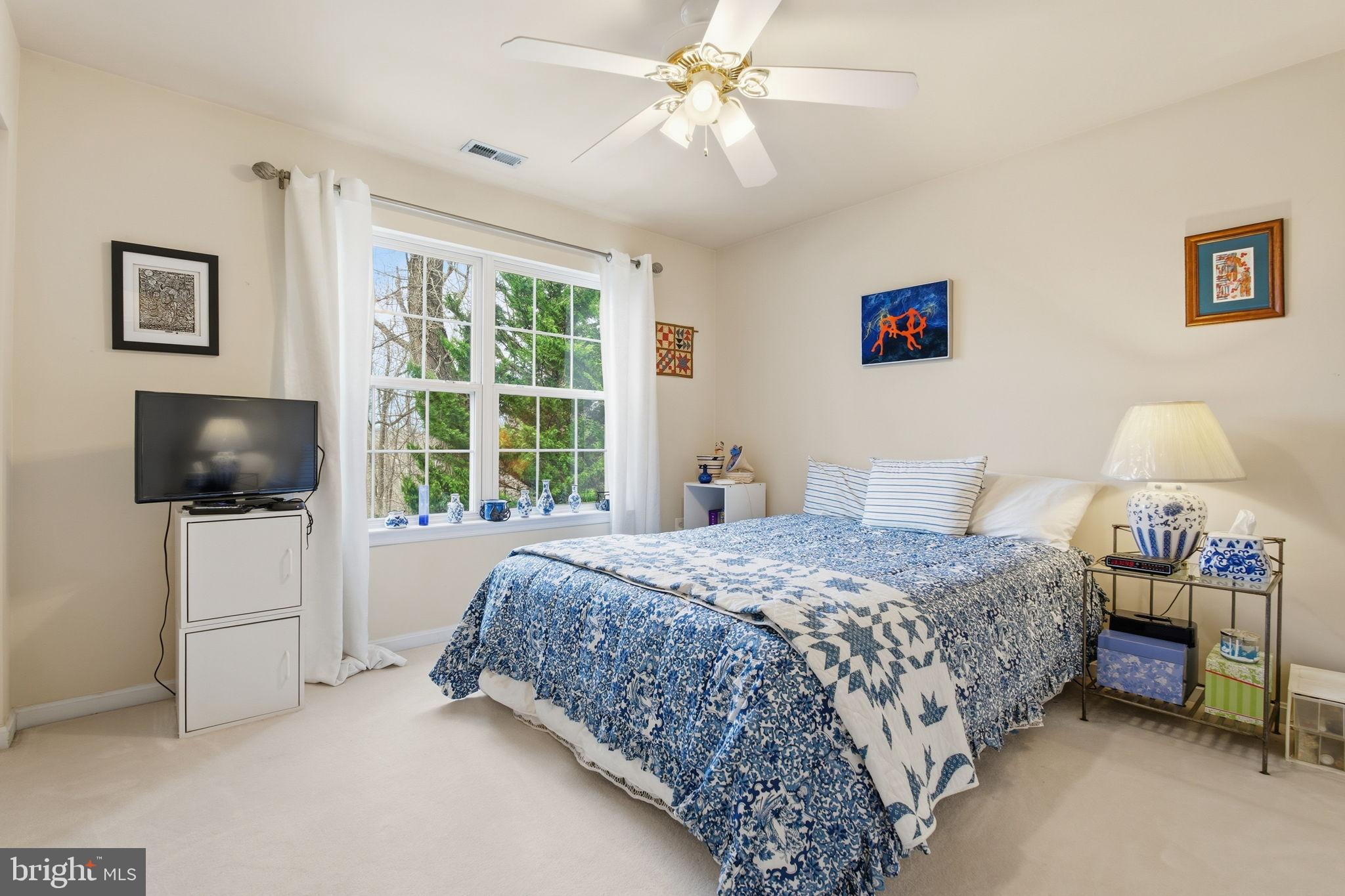 5534 Nutwell Sudley Road Deale, MD 20751 - Photo 37 of 58 Serene bedroom with natural light and charm.