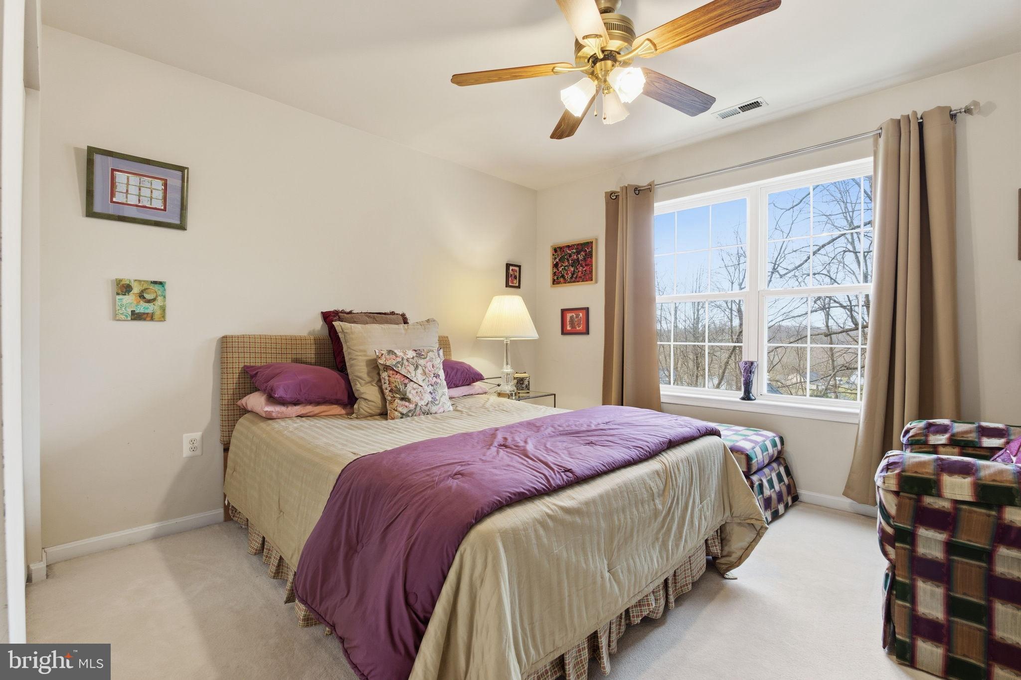 5534 Nutwell Sudley Road Deale, MD 20751 - Photo 38 of 58 Cozy bedroom with natural light and charm.
