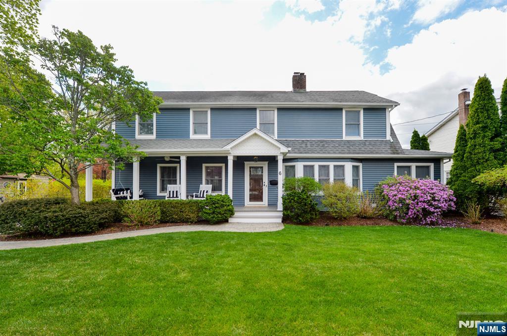 6 Long Avenue Mahwah, NJ 07430 - Photo 1 of 49 a front view of a house with garden and porch
