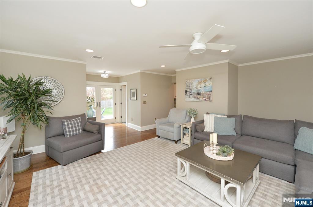 6 Long Avenue Mahwah, NJ 07430 - Photo 13 of 49 a living room with furniture and a dining table with kitchen view