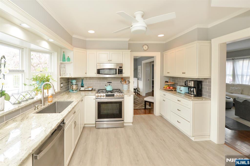 6 Long Avenue Mahwah, NJ 07430 - Photo 17 of 49 a kitchen with stainless steel appliances granite countertop a stove a sink and a refrigerator