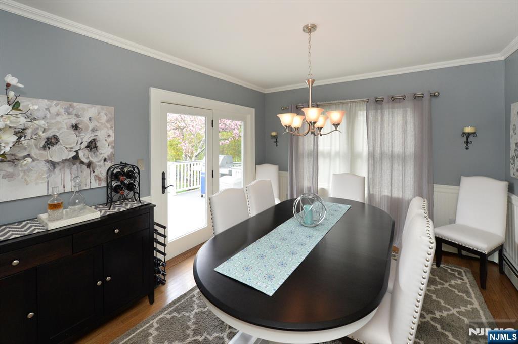 6 Long Avenue Mahwah, NJ 07430 - Photo 20 of 49 a living room with furniture and a chandelier