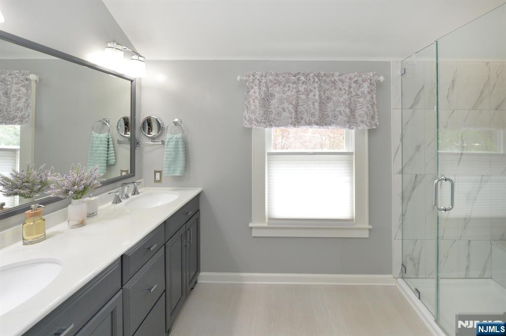 6 Long Avenue Mahwah, NJ 07430 - Photo 31 of 49 a bathroom with a double vanity sink mirror and double