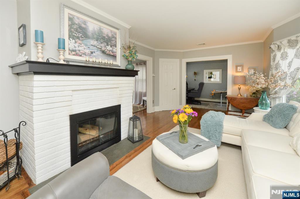 6 Long Avenue Mahwah, NJ 07430 - Photo 5 of 49 a living room with furniture and a fireplace