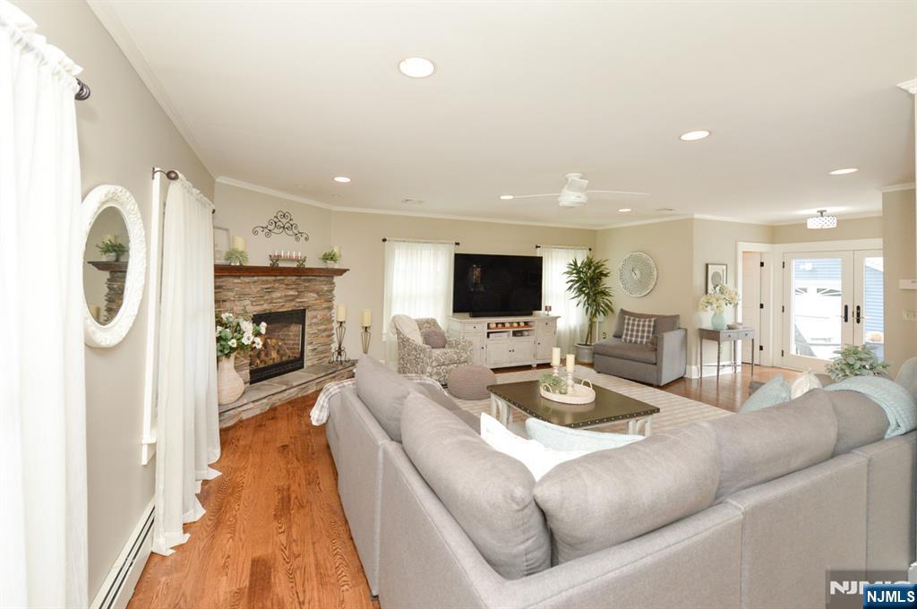 6 Long Avenue Mahwah, NJ 07430 - Photo 9 of 49 a living room with fireplace furniture and a flat screen tv