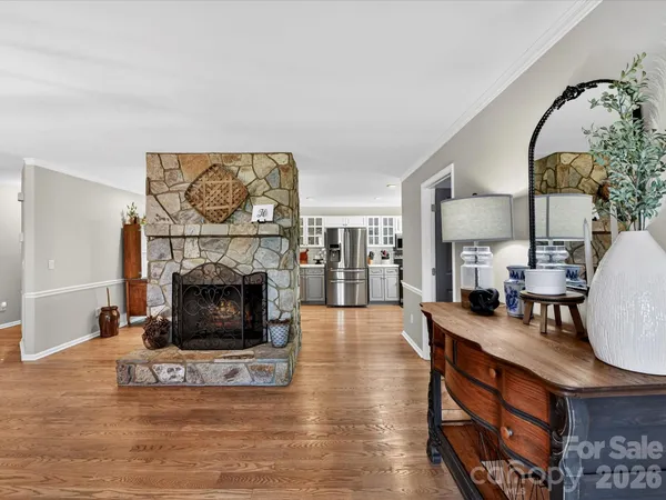 a dining room with furniture and wooden floor