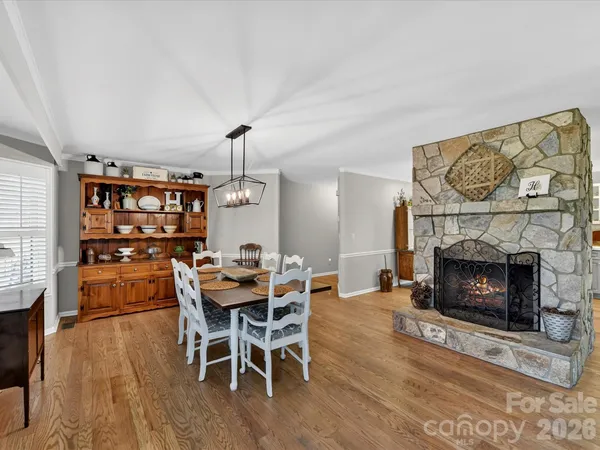 a kitchen with granite countertop a refrigerator and a sink