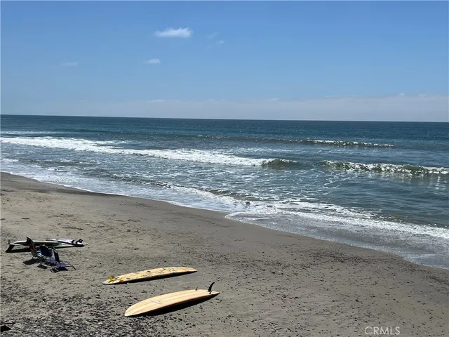 a view of a balcony with wooden floor