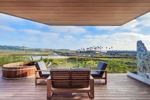 a view of swimming pool with outdoor seating and city view