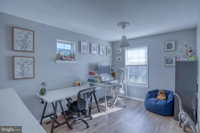 a workspace with furniture and window