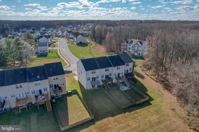 an aerial view of a house with a swimming pool