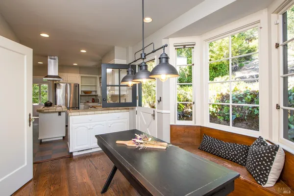 a view of a dining room with furniture window and outside view
