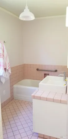 a kitchen with a sink and a stove top oven