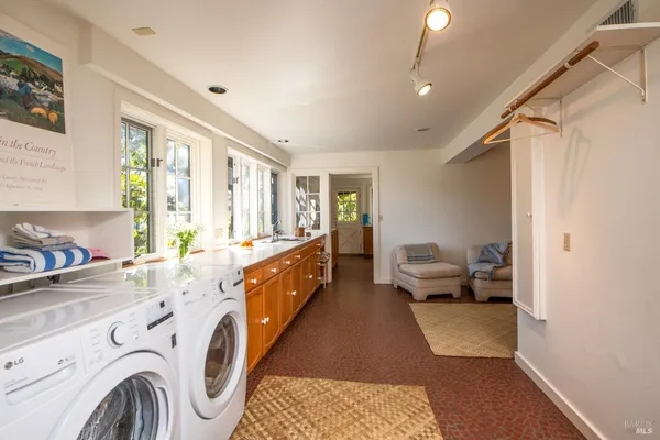 a kitchen with a sink a stove and cabinets