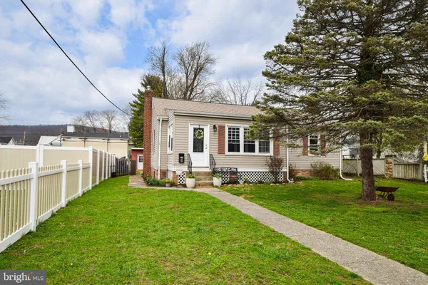 a view of a studio with wooden floor