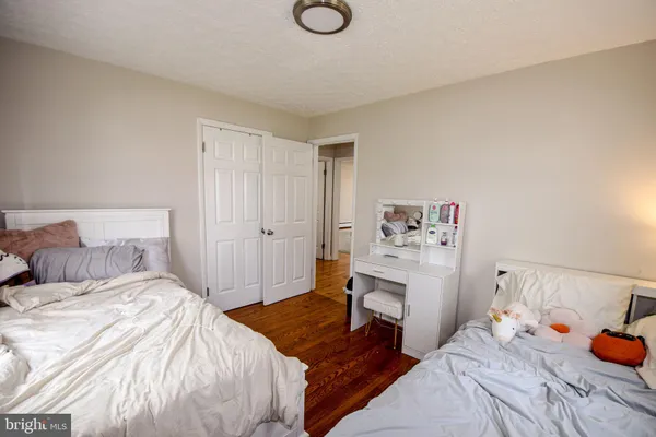 a room with toys and a wooden floor