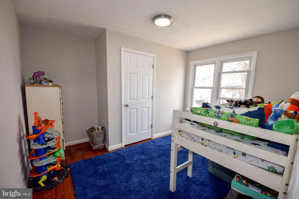 a room with furniture and wooden floor