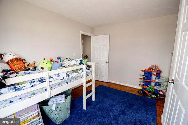 a bathroom with a toilet a sink and a window